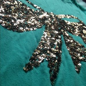 Blue long sleeve shirt with gold sequin bow